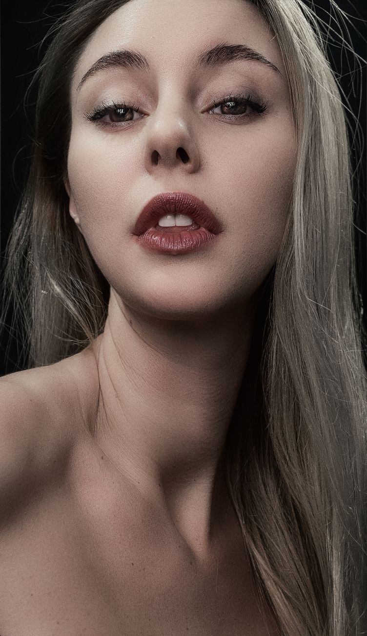 Close portrait of a woman with red lips